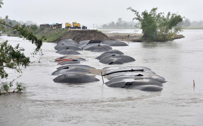 Geo sand bags being put an embankment in Lakhimpur district, on August 12, 2017. PHOTO/ Biju BORO