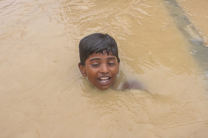 A boy swims as he was crossing the floded area caused by Sirisiya River in Ramghaduwa , Parsa District , Nepal