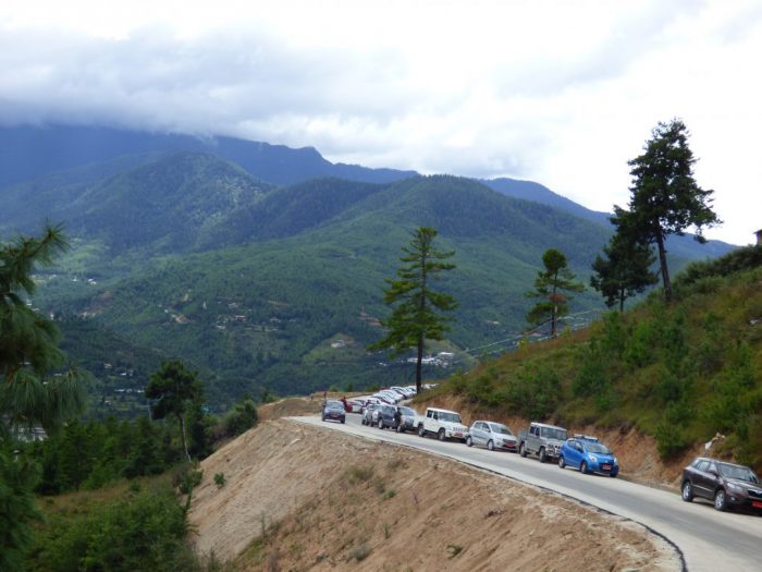 Vehicles lined up near the newly-completed Giant Buddha stupa in Thimphu, Bhutan [Image: Dawa Gyelmo]