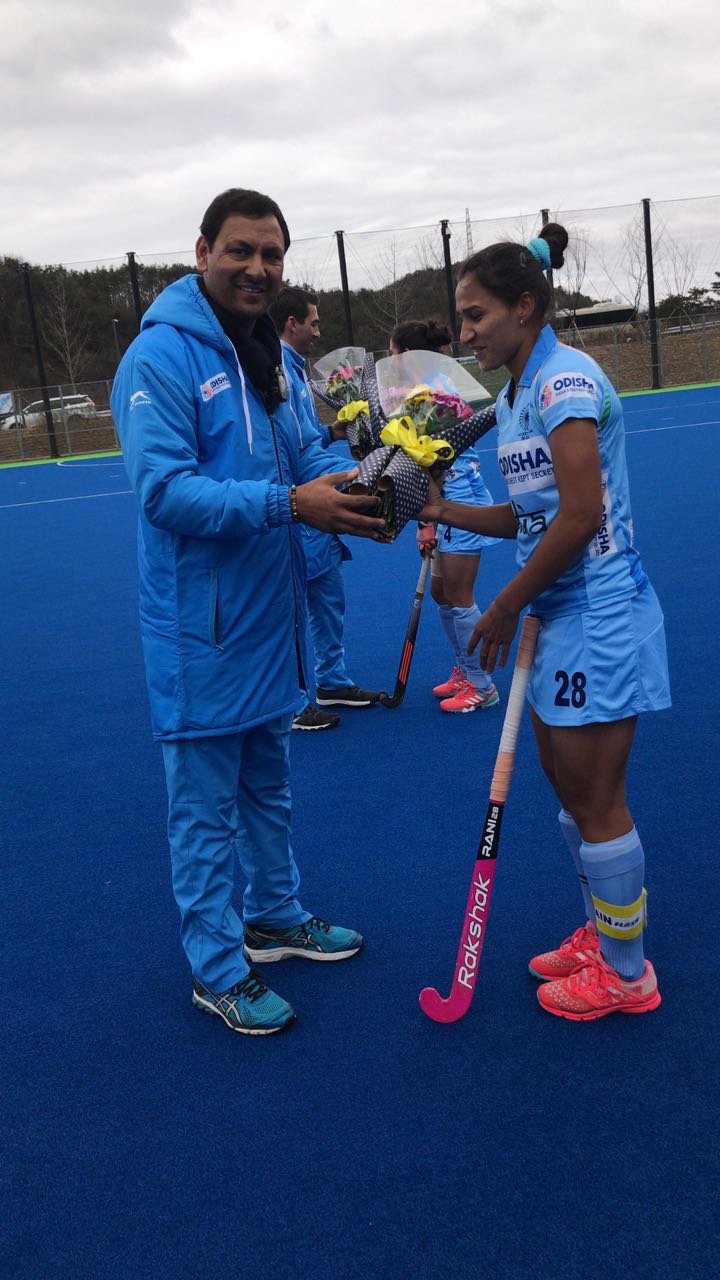 Rani being felicitated by Indian Team Chief Coach Harendra Singh in Jinchun, Korea. 