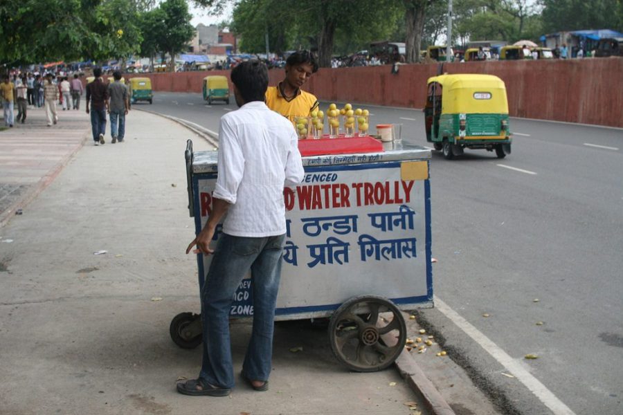 A man selling refrigerated water on Delhi’s street [image by: Chris Wilson]