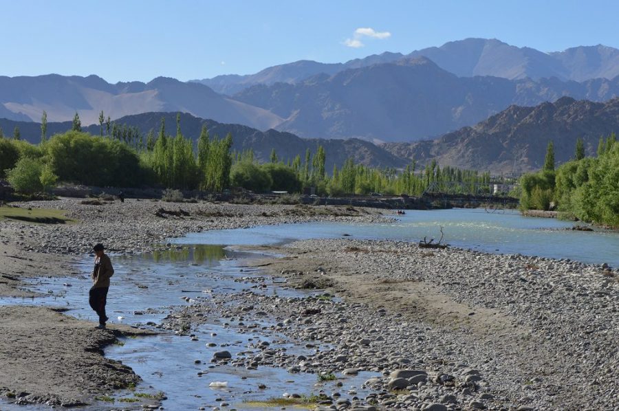 A boy crossing a small channel containing sewage which drains into the Indus near Choglamsar in Leh [image by: Athar Parvaiz]